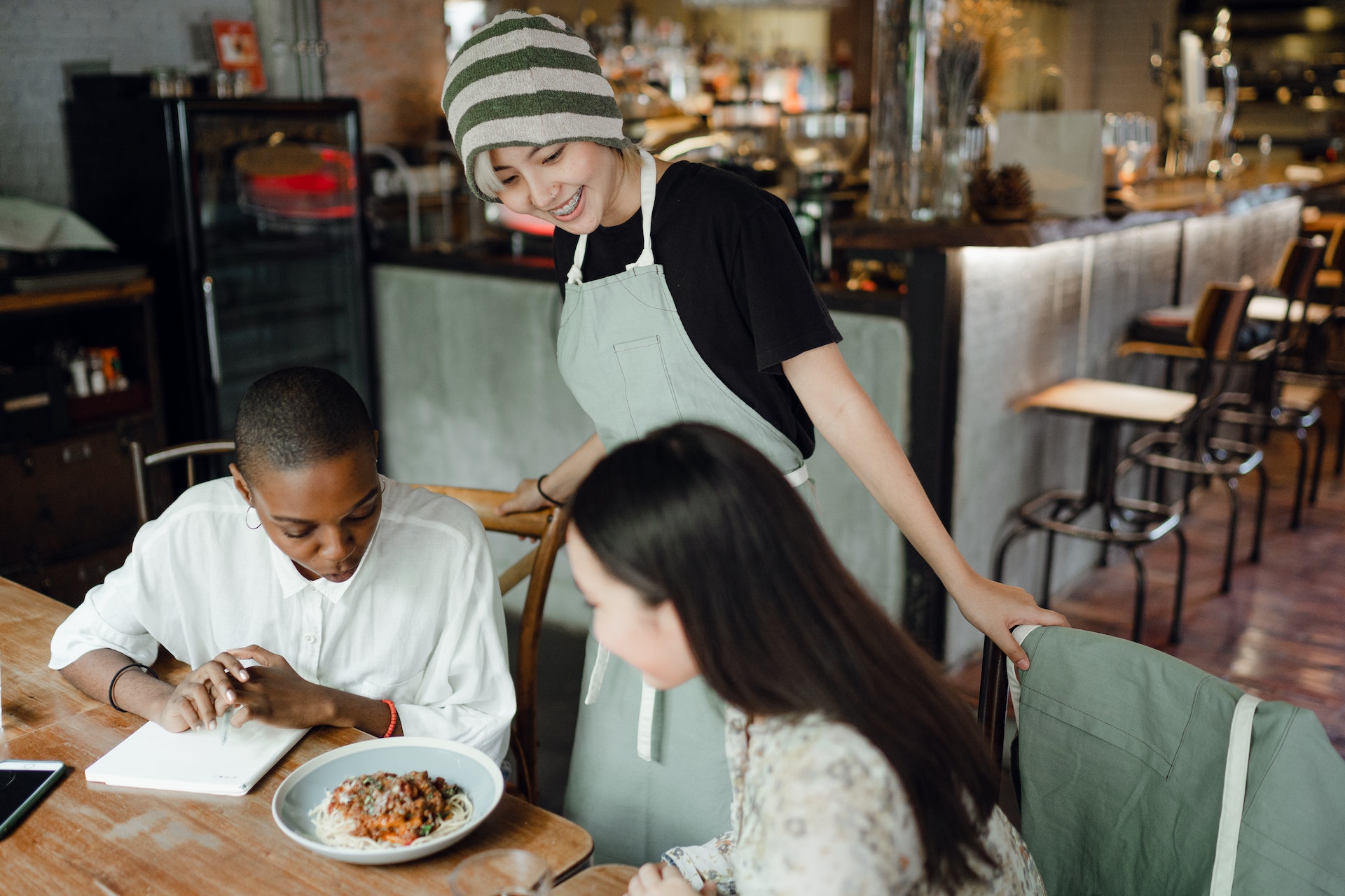 Waitress helping customers